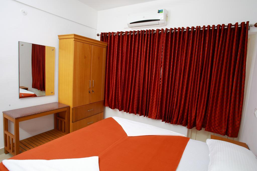 Hotel Phils' Residency & Banquets Kochi Pokoj fotografie